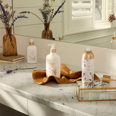 Thymes Lavender Honey Body Lotion on countertop